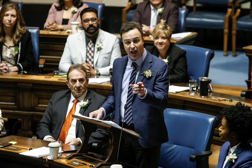 Manitoba Finance Minister Adrien Sala delivers the provincial budget in the Manitoba legislature in Winnipeg, Tuesday, April 2, 2024.  THE CANADIAN PRESS/John Woods.