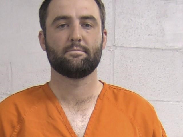 In this mug shot provided by the Louisville Metropolitan Department of Corrections Friday, May 17, 2024, Scott Scheffler is shown. Masters champion Scottie Scheffler was detained by police Friday morning on his way to the PGA Championship, with stunning images showing him handcuffed as he was led to a police car.