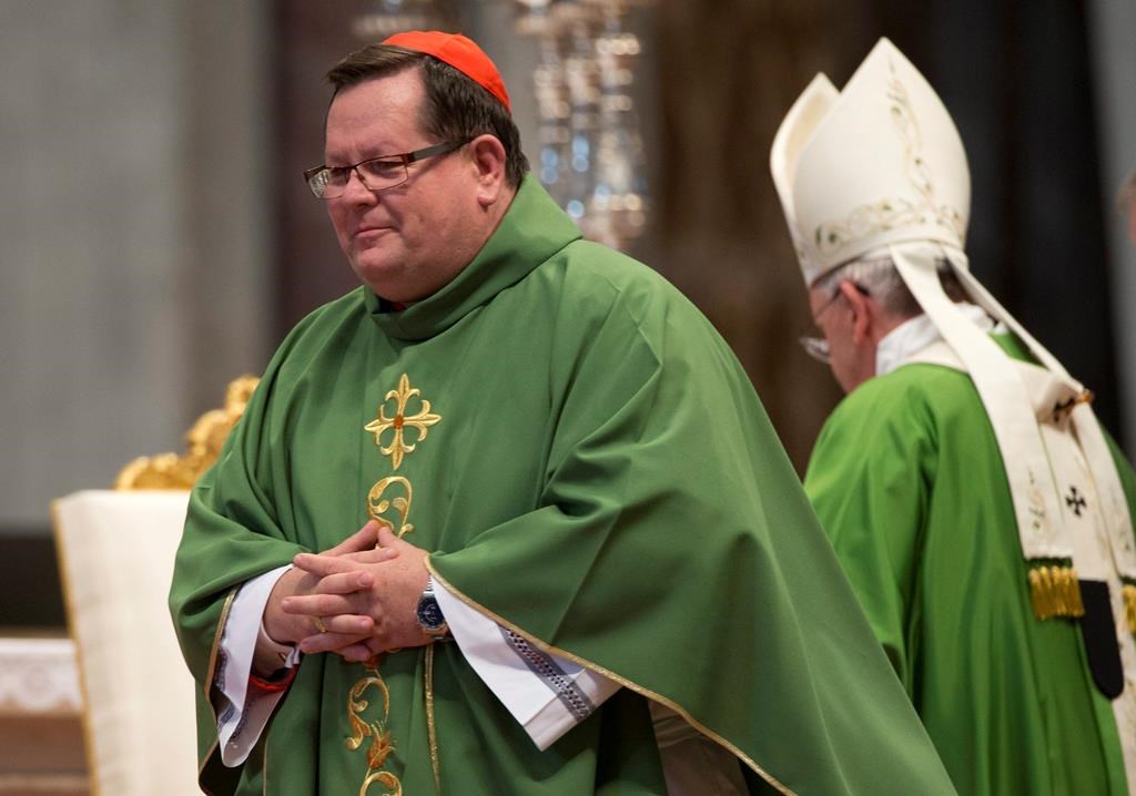 Cardinal Gerald Lacroix, Archbishop of Quebec leaves after he delivering a speech during a mass in St. Peter's Basilica, at the Vatican, Sunday, Oct. 12, 2014.