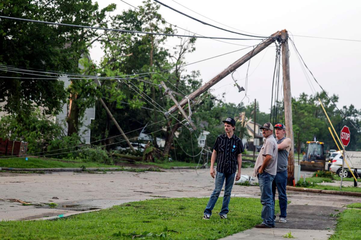 People view storm damage, Sunday, May 26, 2024, in Claremore, Okla. Powerful storms left a wide trail of destruction Sunday across Texas, Oklahoma and Arkansas after obliterating homes and destroying a truck stop where dozens sought shelter in a restroom during the latest deadly weather to strike the central U.S. (Mike Simons/Tulsa World via AP)
