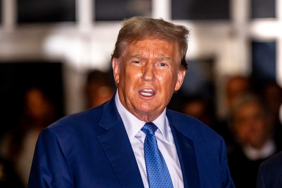 Donald Trump in a blue suit and tie.