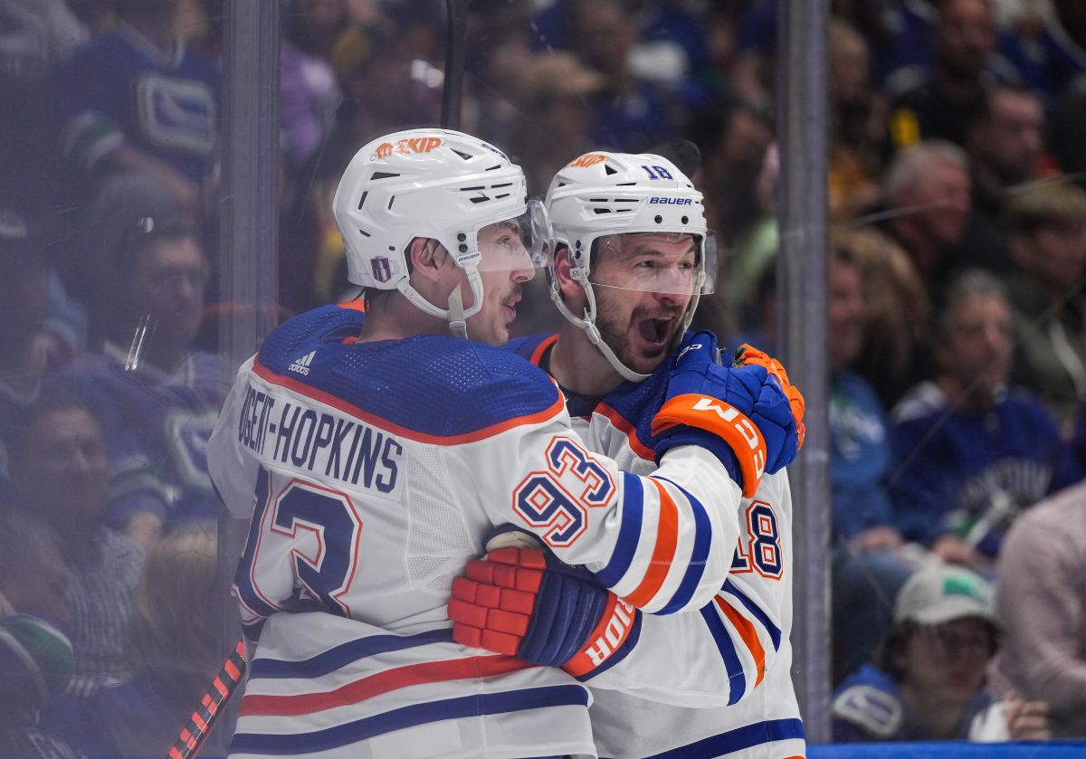 Edmonton Oilers' Ryan Nugent-Hopkins, left, and Zach Hyman celebrate Nugent-Hopkins's goal against the Vancouver Canucks during the second period in Game 7 of an NHL hockey Stanley Cup second-round playoff series, in Vancouver, on Monday, May 20, 2024.