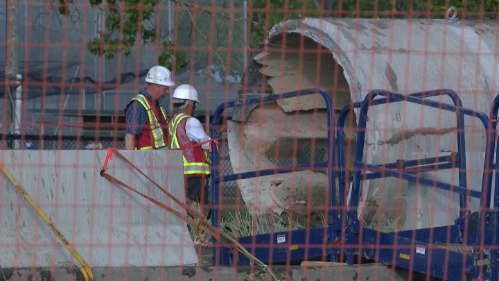 Crews in Calgary work on a water main break on June 10, 2024.