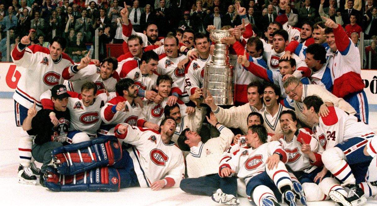 The Montreal Canadiens pose for a photograph with the Stanley Cup following their 4-1 victory over the Los Angeles Kings in Montreal in this June 9, 1993 photo. Patrick Roy front left lying down.