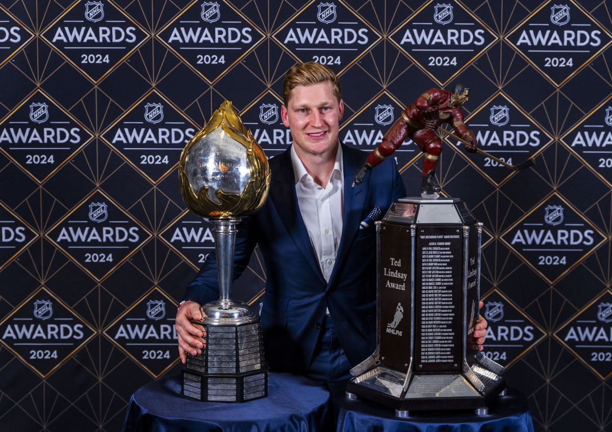 Colorado Avalanche forward Nathan MacKinnon stands with his trophies as the recipient of the Hart Memorial Trophy, left, and Ted Lindsay Award at hockey's NHL Awards, Thursday, June 27, 2024, in Las Vegas.