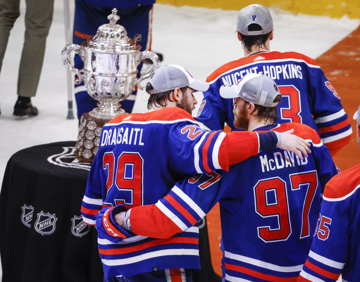 Edmonton Oilers forward Connor McDavid (97) and forward Leon Draisaitl (29) embrace after defeating the Dallas Stars in Game 6 of the Western Conference finals of the NHL hockey Stanley Cup playoffs in Edmonton, Sunday, June 2, 2024.