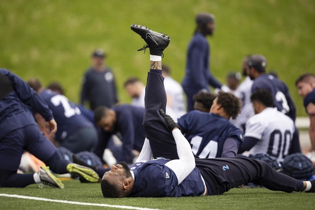 Shawn Oakman stretches during CFL training camp at Alumni Stadium in Guelph, Ont., Sunday, May 12, 2024.