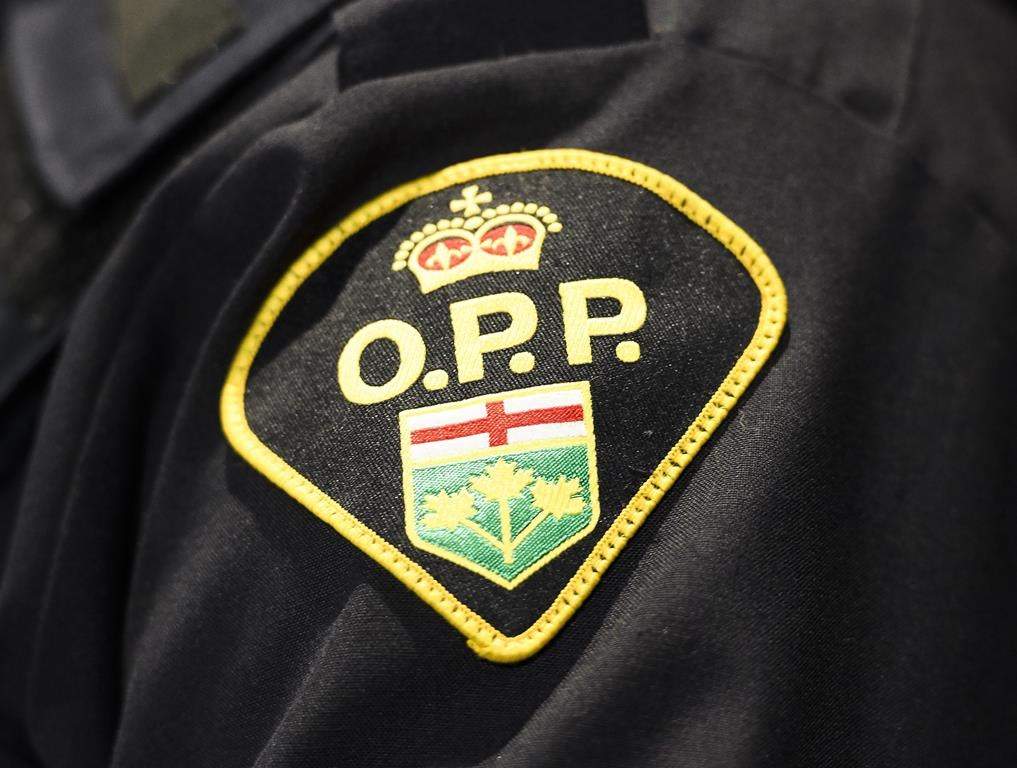 An Ontario Provincial Police logo is shown during a press conference in Barrie, Ont., on April 3, 2019. THE CANADIAN PRESS/Nathan Denette.