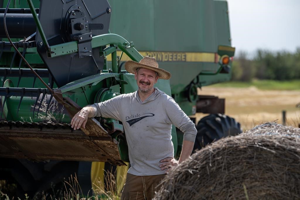 Farmer Will Robbins stands for a photograph at his farm near Laura, Sask., Wednesday, Aug. 21, 2024. Robbins, a younger producer who's taking over the family farm, says the prices of farmland are so high that he doesn't consider expanding the farm. THE CANADIAN PRESS/Liam Richards.