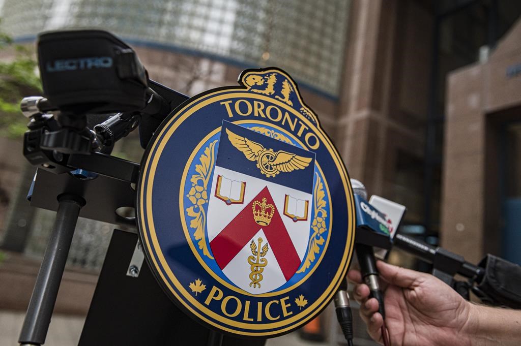One man is dead after a Friday evening shooting in Toronto's east end. The Toronto Police Services emblem is photographed during a press conference at TPS headquarters, in Toronto on Tuesday, May 17, 2022. 