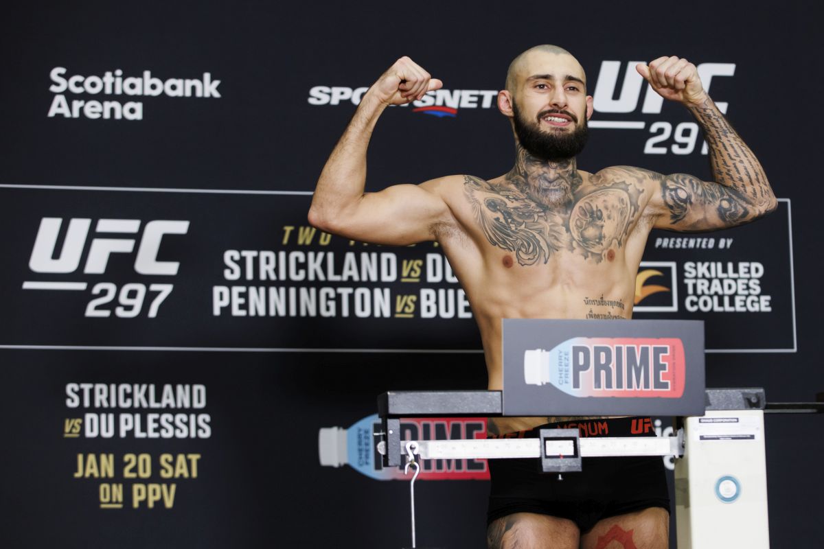 Charles Jourdain weighs in ahead of his UFC Featherweight bout in Toronto, Friday, Jan. 19, 2024.