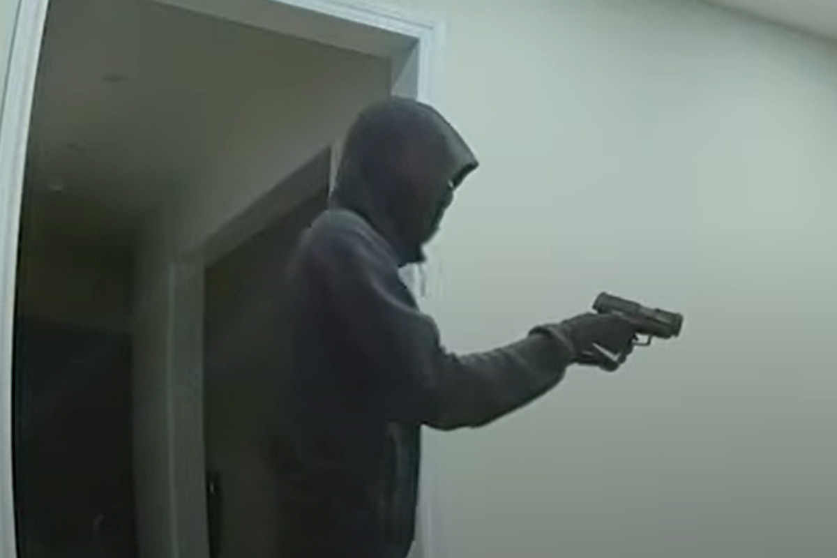 In the video, a man appears to be waving a gun at his victims.