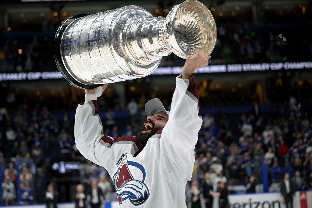 Colorado Avalanche centre Nazem Kadri lifts the Stanley Cup after the team defeated the Tampa Bay Lightning in Game 6 of the NHL hockey Stanley Cup Finals on June 26, 2022, in Tampa, Fla. Pulling out a chunk of his idol Joe Thornton's beard in a fight, riding the roller-coaster of being a Toronto Maple Leaf and becoming the first Muslim player to win a Stanley Cup are chronicled in Kadri's book "Dreamer: My Life On The Edge."