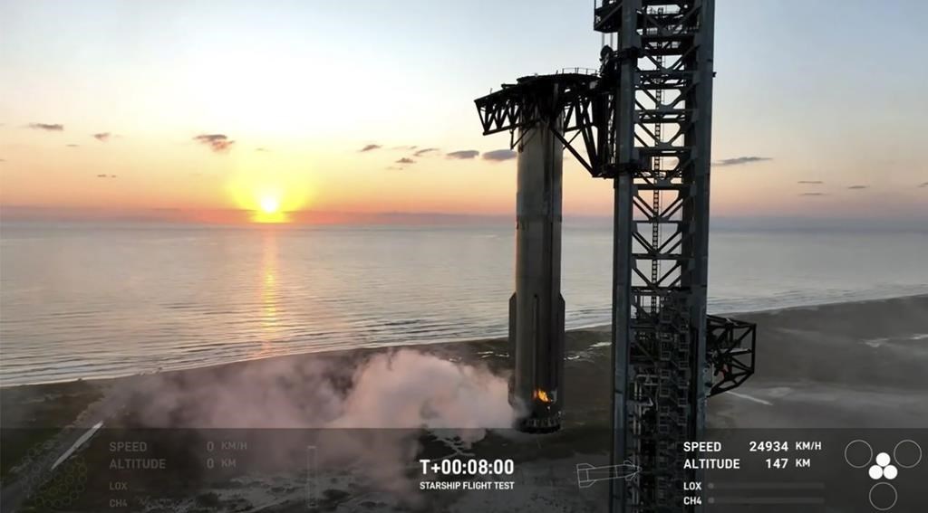 This image provided by SpaceX shows SpaceX's mega Starship rocket upon its return during a test flight, Sunday, Oct. 13, 2024, over Boca Chica, Texas.