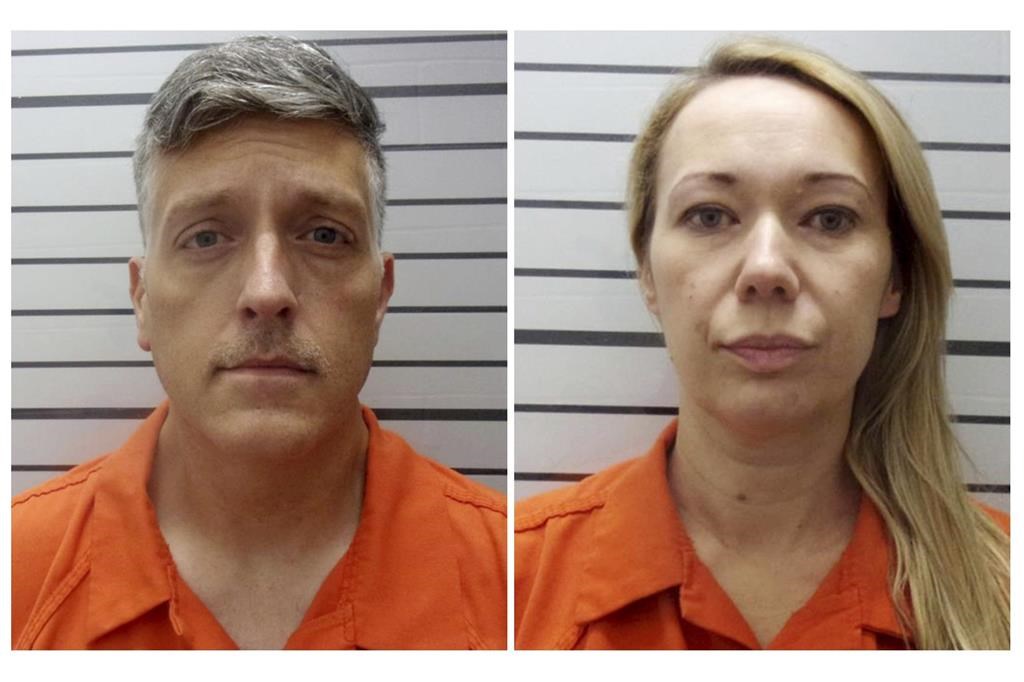 FILE - This combination of booking photos provided by the Muskogee County, Okla., Sheriff's Office shows Jon Hallford, left, and Carie Hallford, owners of Return to Nature Funeral Home. (Muskogee County Sheriff's Office via AP, File).