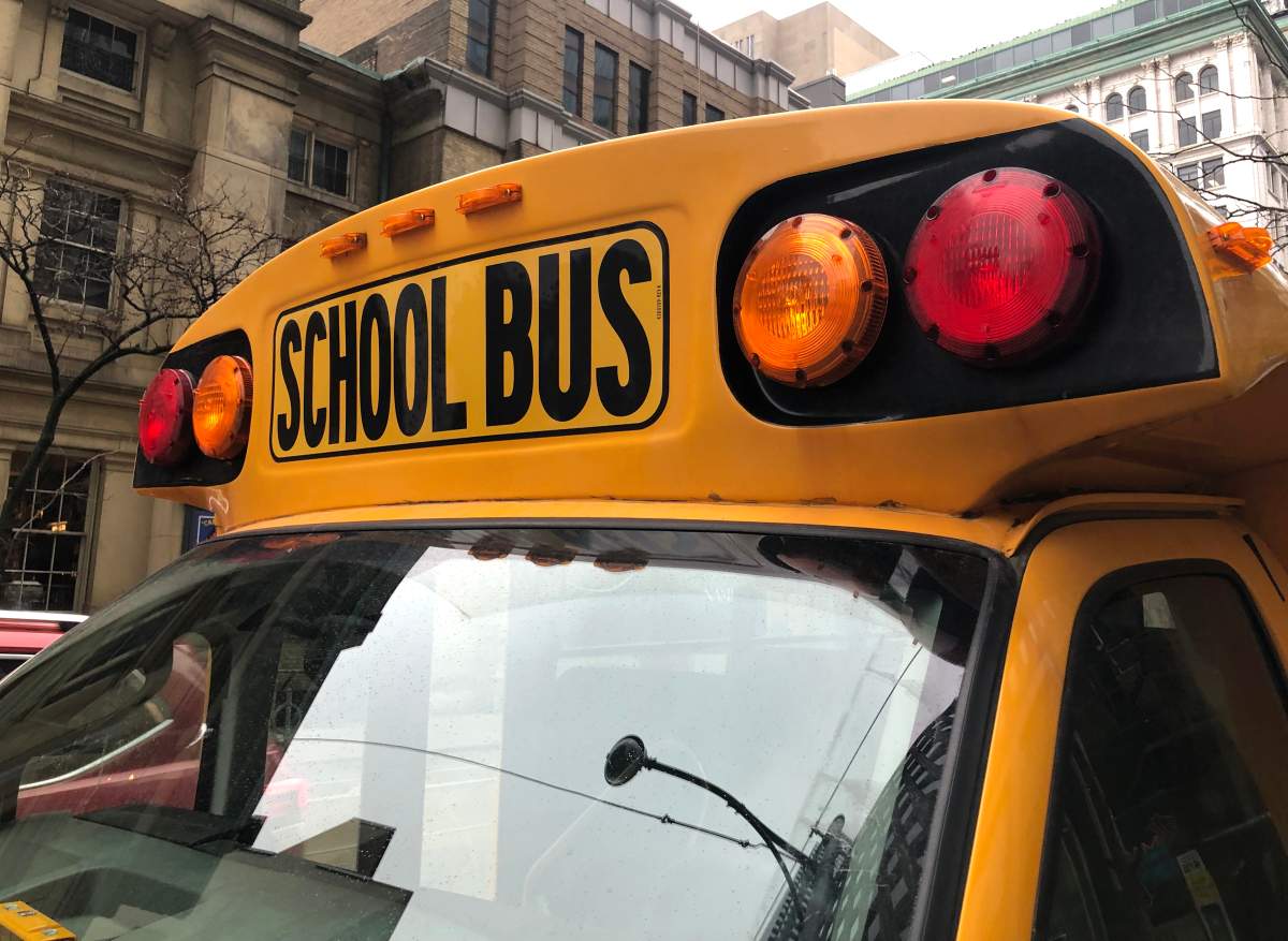 A school bus sits idle on Adelaide Street in Toronto, Tuesday, Jan. 17, 2023.