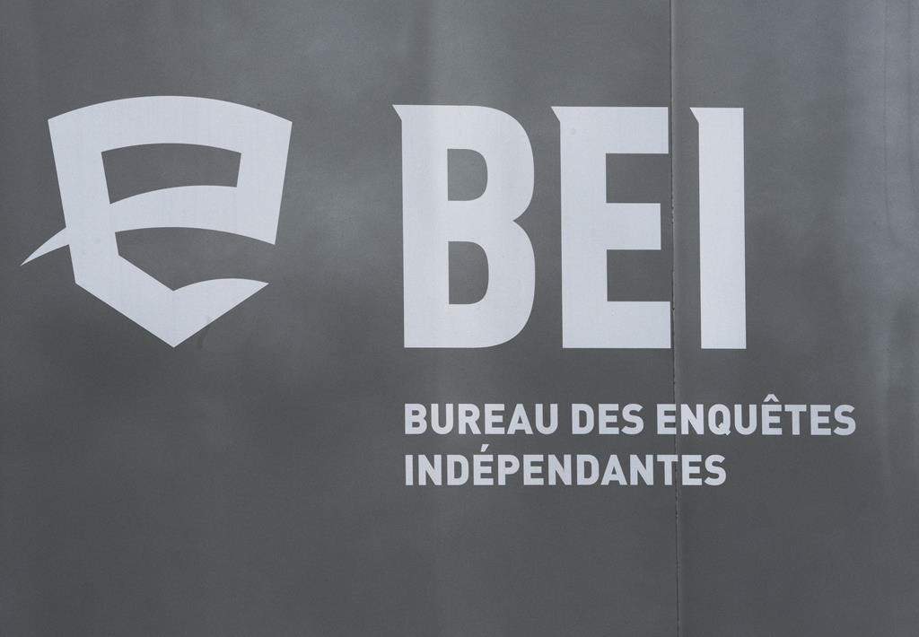 The province's police watchdog is providing some new details about police-involved shooting that left one man dead and a second seriously injured in a remote northern Quebec village. A logo for BEI, Quebec’s independent police bureau, is seen in Louiseville, Que., Tuesday, March 28, 2023. THE CANADIAN PRESS/Ryan Remiorz.