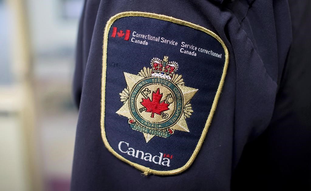 Patches are seen on the arm and shoulder of a corrections officer in the segregation unit at the Fraser Valley Institution for Women during a media tour, in Abbotsford, B.C., Oct. 26, 2017. THE CANADIAN PRESS/Darryl Dyck.