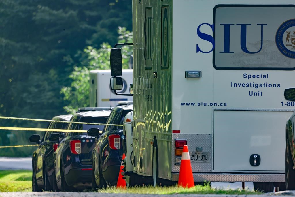 Vehicles from the provincial Special Investigations Unit (SIU) are shown in Innisfil, Ont., on Friday Aug. 16, 2024.