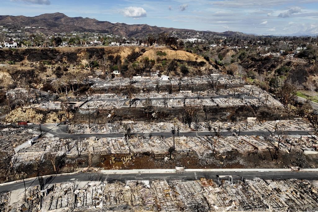 An aerial view shows the devastation left by the Palisades Fire in the Pacific Palisades section of Los Angeles, Monday, Jan. 27, 2025.