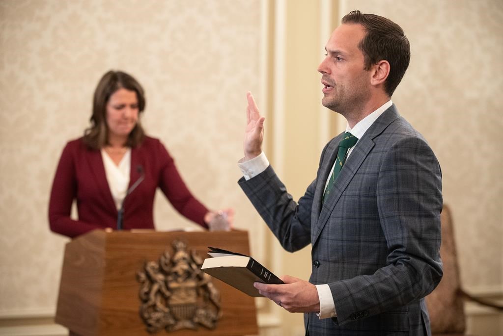 Alberta Jobs Minister Matt Jones, pictured here at his swearing in 2023, says the temporary leave measure will insure reservists keep their civilian jobs while deployed on G7 duties. THE CANADIAN PRESS/Jason Franson.