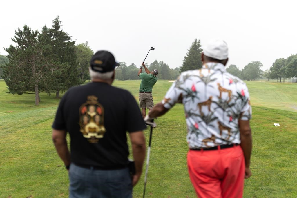 A still handout image from a new documentary film titled "Apex: The Black Masters" is shown. The film streaming on CBC Gem examines the relationship between a Nova Scotia Black community and a neighbouring golf course. In a scene from the film, golfers tee off at the 50th anniversary edition of the Apex Invitational Golf Tournament held Aug. 3-4, 2024, in Truro, N.S. THE CANADIAN PRESS/HO-A+B Roll Films *MANDATORY CREDIT*
.