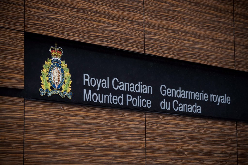 A Toronto couple is facing charges after allegedly defrauding hundreds of Canadians out of millions of dollars. The RCMP logo is seen in Surrey, B.C., Friday, April 13, 2018. THE CANADIAN PRESS/Darryl Dyck.
