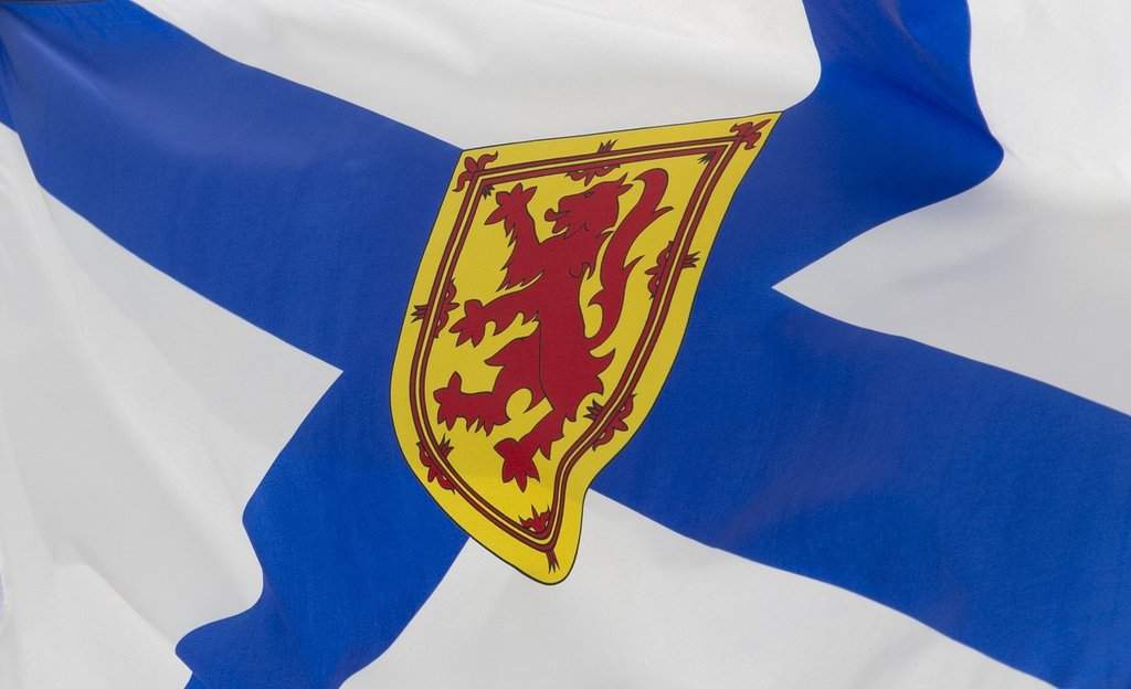 Proposed legislation dealing with effective representation in the Nova Scotia legislature for the Acadian region of Chéticamp will proceed unchanged, despite voter parity concerns raised by the Halifax Chamber of Commerce. Nova Scotia's provincial flag flies  in Ottawa, Friday, July 3, 2020. THE CANADIAN PRESS/Adrian Wyld.