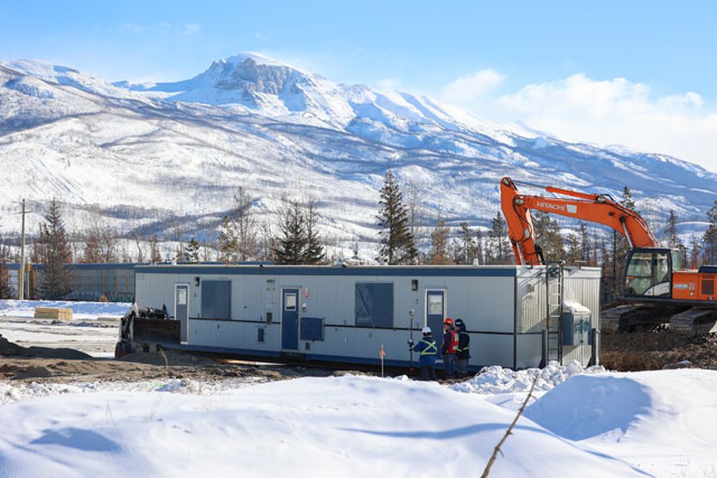 Workers set up temporary housing units which will be occupied by locals who lost their homes in last summer's wildfire in Jasper, Alberta on Tuesday, Feb. 12, 2024.
