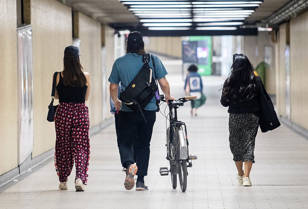 Montreal officials say they're temporarily boosting security patrols and cracking down on loitering in the city's metro system in order to increase transit users' sense of security. A man wheels his bicycle through a metro station in Montreal, April 16, 2023. THE CANADIAN PRESS/Graham Hughes.