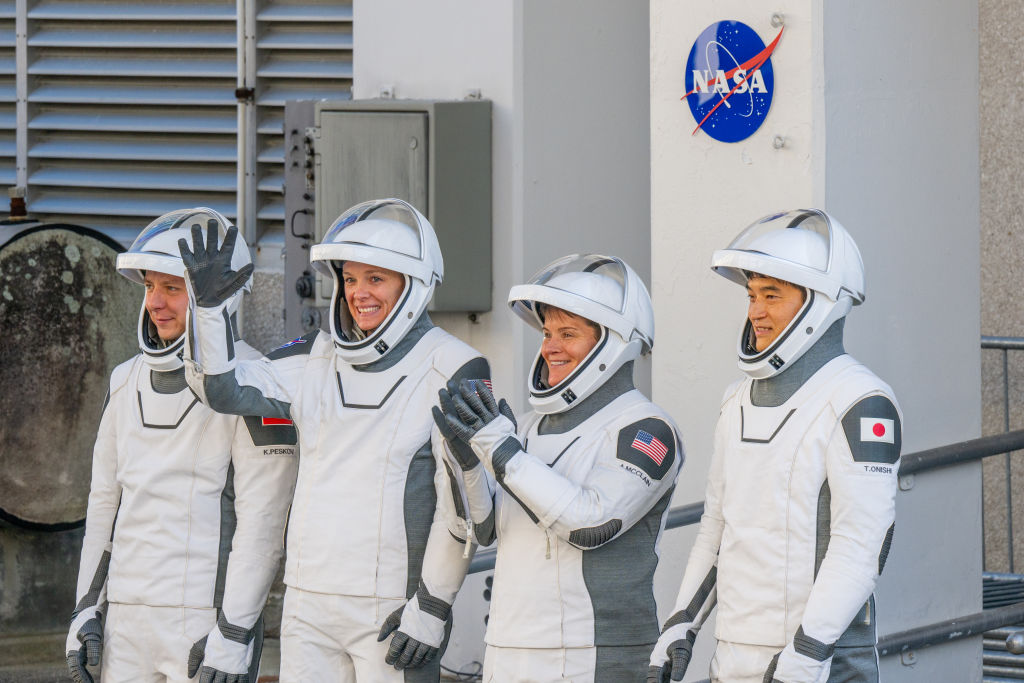 NASA astronauts commander Anne McClain, pilot Nichole Ayers, alongside mission specialists, JAXA (Japan Aerospace Exploration Agency) astronaut Takuya Onishi and Roscosmos cosmonaut Kirill Peskov exit the Neil A. Armstrong Operations and Checkout building at NASA Kennedy ahead of launch on March 12, 2025 in Cape Canaveral, Florida. NASA astronauts commander Anne McClain, pilot Nichole Ayers, alongside mission specialists, JAXA (Japan Aerospace Exploration Agency) astronaut Takuya Onishi and Roscosmos cosmonaut Kirill Peskov. The SpaceX Falcon 9 rocket and Dragon spacecraft is undergoing final preparations ahead of its 7:48pm launch later tonight. (Photo by Brandon Bell/Getty Images)