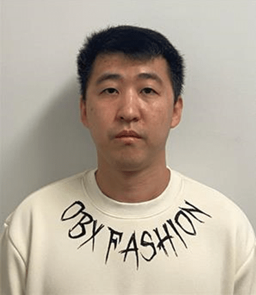 Tian Zhang is unlawfully at large.