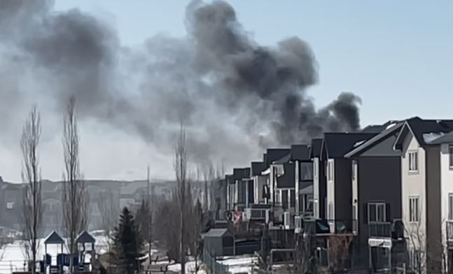 The flames and smoke from this Airdrie house fire were so intense that firefighters had to go into defensive mode shortly after the arrived to prevent the fire from spreading to other homes.