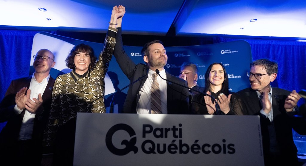 Parti Quebecois (PQ) candidate Catherine Gentilcore, second left, and party leader Paul St-Pierre Plamondon celebrate after winning the byelection in Terrebonne, Que., Monday, March 17, 2025. THE CANADIAN PRESS/Christinne Muschi.
