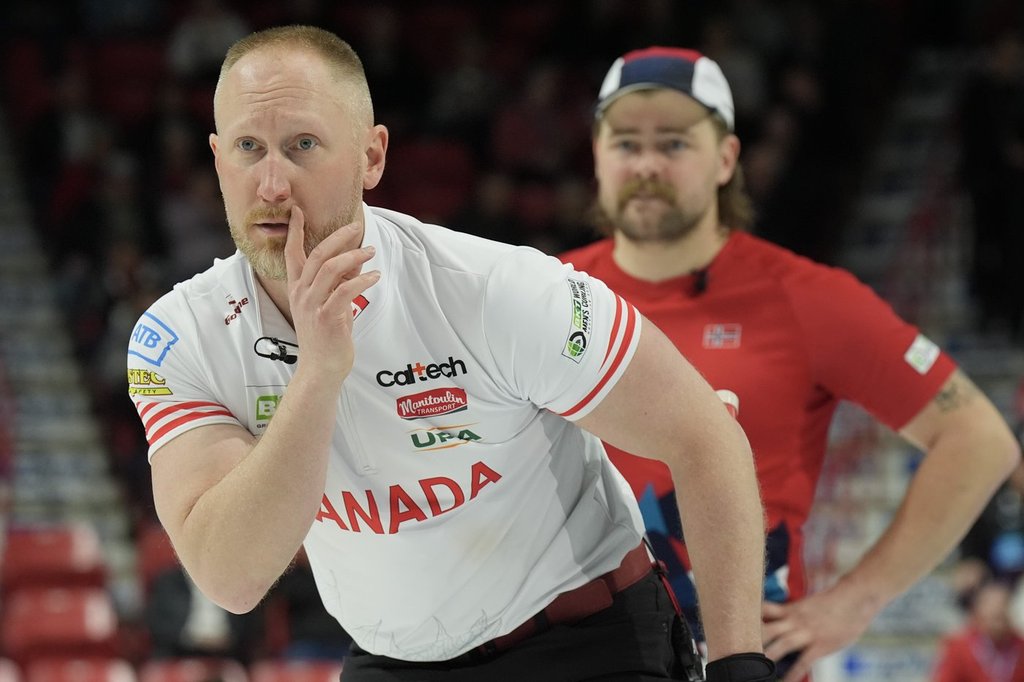 Canada skip Brad Jacobs watches his stone as Norway's Martin Sesaker looks on at the BKT World Men's Curling Championship in Moose Jaw, Sask., on Wednesday, April 2, 2025.