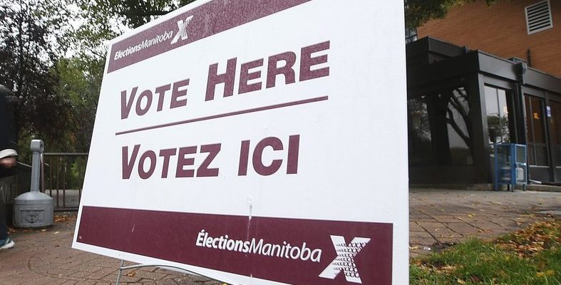 An election sign is seen outside a polling station in this file photo. 