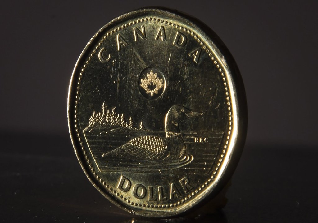 <p>The Canadian dollar coin is pictured in North Vancouver, B.C. Wednesday, May 29, 2019. THE CANADIAN PRESS/Jonathan Hayward</p>.