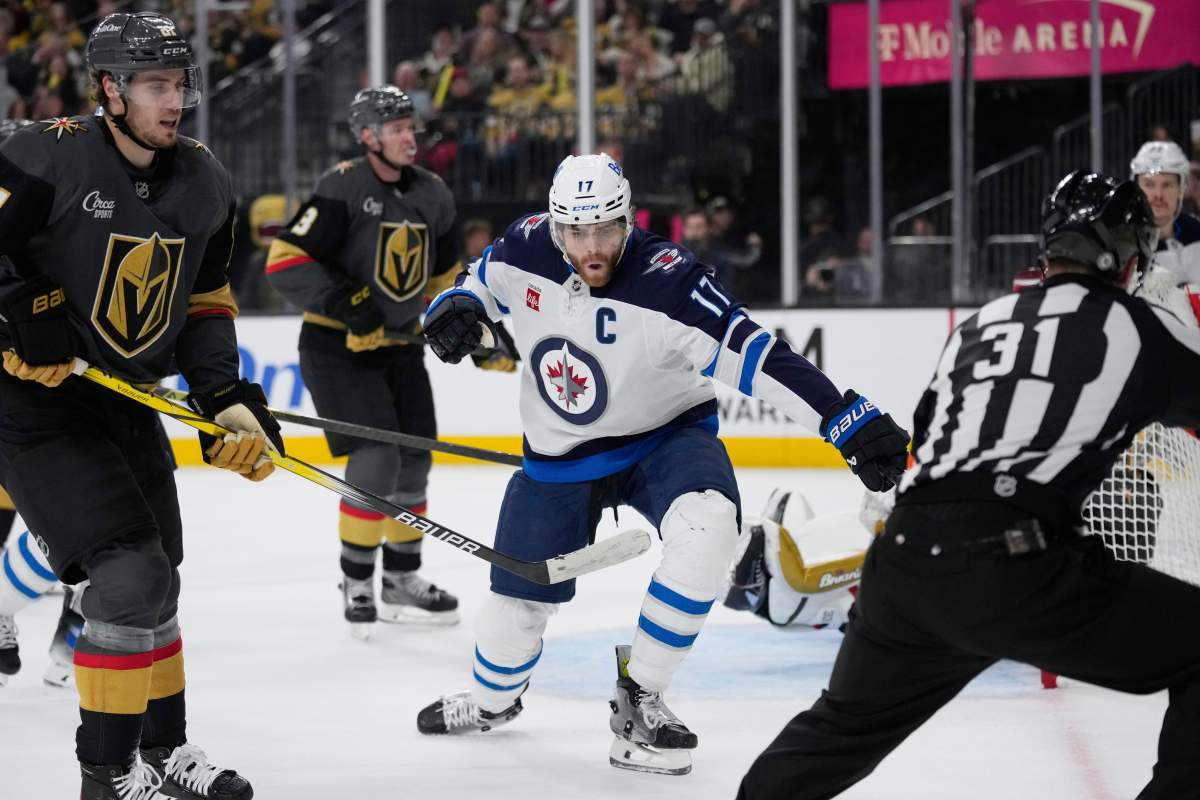 Winnipeg Jets center Adam Lowry (17) celebrates after scoring against the Vegas Golden Knights during the first period of an NHL hockey game Thursday, April 3, 2025, in Las Vegas. 