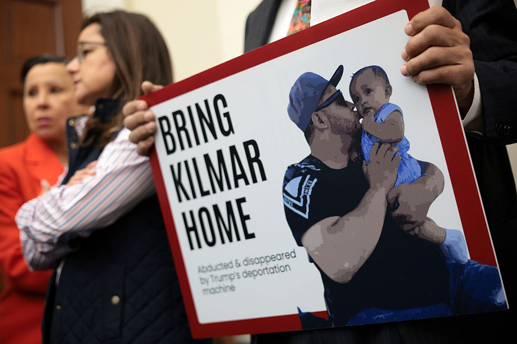 A member of the Congressional Hispanic Caucus holds a picture of Kilmar Abrego Garcia during a news conference to discuss Abrego Garcia's arrest and deportation d at Cannon House Office Building on April 9, 2025 in Washington, DC. The Congressional Hispanic Caucus held a news conference to discuss the deportation of Maryland resident Kilmar Abrego Garcia to the maximum security prison Terrorism Confinement Center (CECOT) in El Salvador, an incident the Trump administration claims as “an administrative error,” but refuses to bring Abrego Garcia back to the United States.