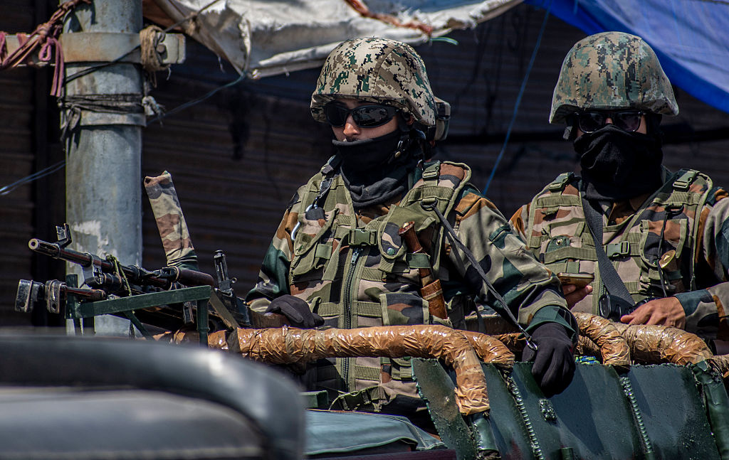 Indian army soldiers stand guard atop their vehicle, following an attack on Indian tourists by gunmen on April 23, 2025 in Srinagar, India.