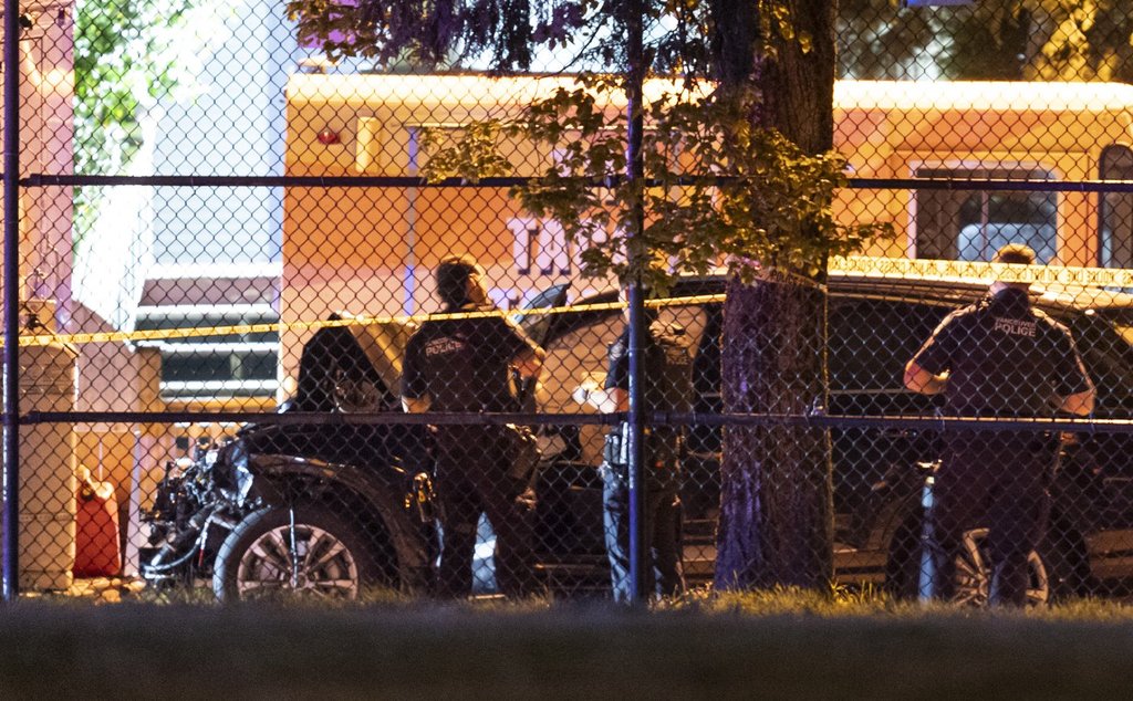 Vancouver Police look over a black car believed to be involved in an incident where a vehicle drove into a crowd at the Lapu Lapu Festival in Vancouver on Saturday April 26, 2025.