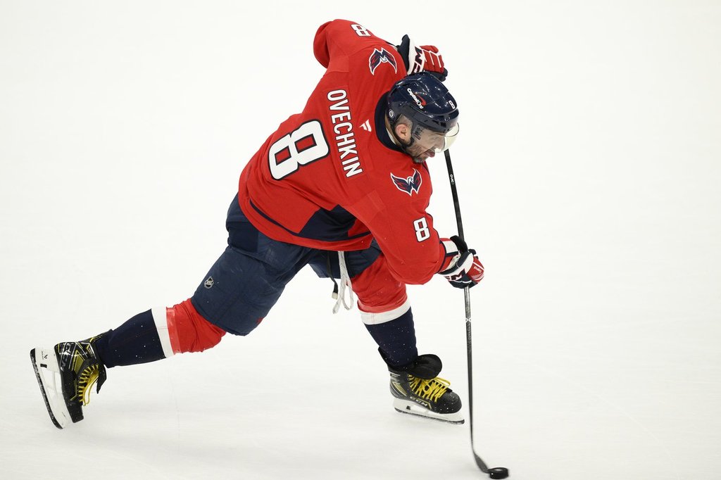 Washington Capitals left wing Alex Ovechkin (8) shoots during the third period of an NHL hockey game against the Buffalo Sabres, Sunday, March 30, 2025, in Washington.