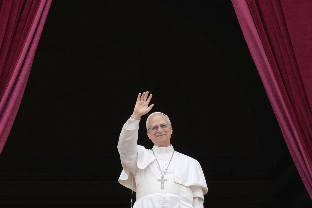 Pope Leo XIV appears on the central balcony of St. Peter's Basilica at the Vatican to bless the crowd below on May 11, 2025.