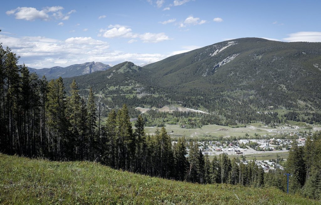 Grassy Mountain, peak to left, and the Grassy Mountain Coal Project are seen north of Blairmore, Alta., Thursday, June 6, 2024.