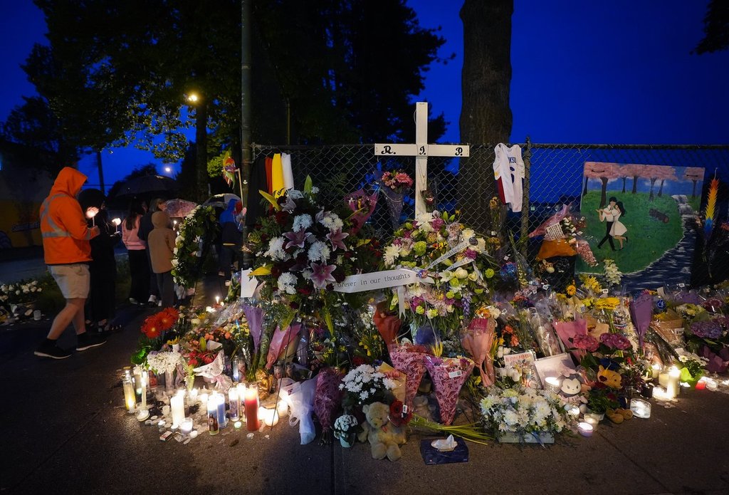 People hold a candlelight march during a vigil on the street where a vehicle-ramming attack occurred at the Filipino community’s Lapu Lapu Day festival last week, on a provincial day of mourning for the victims, in Vancouver, on Friday, May 2, 2025.