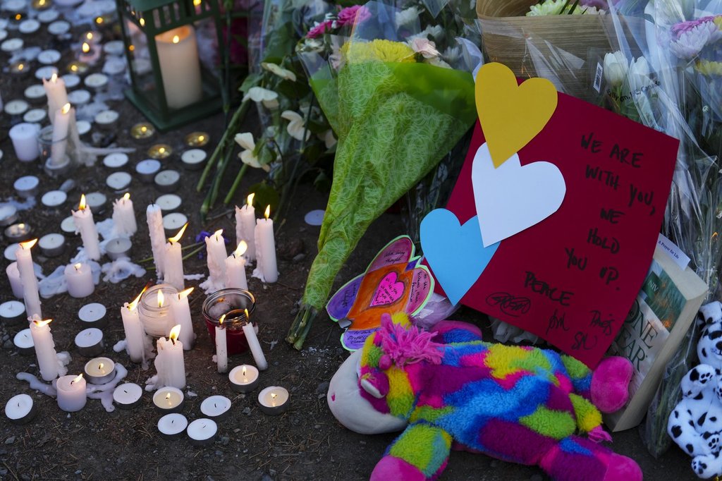 Candles burn at a memorial for the Lapu Lapu Day block party tragedy in Vancouver, B.C., on Sunday, April 27, 2025.
