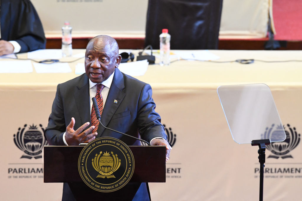 South African President Cyril Ramaphosa gestures as he delivers the State of the Nation address at the Cape Town City Hall on February 6, 2025