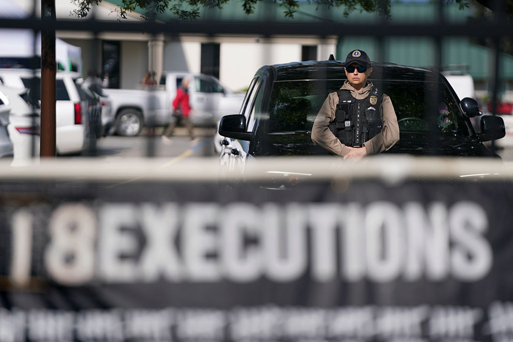 A member of law enforcement stands near a vehicle at the department of corrections before the scheduled firing squad execution of South Carolina inmate Mikal Mahdi on April 11, 2025 in Columbia, South Carolina.
