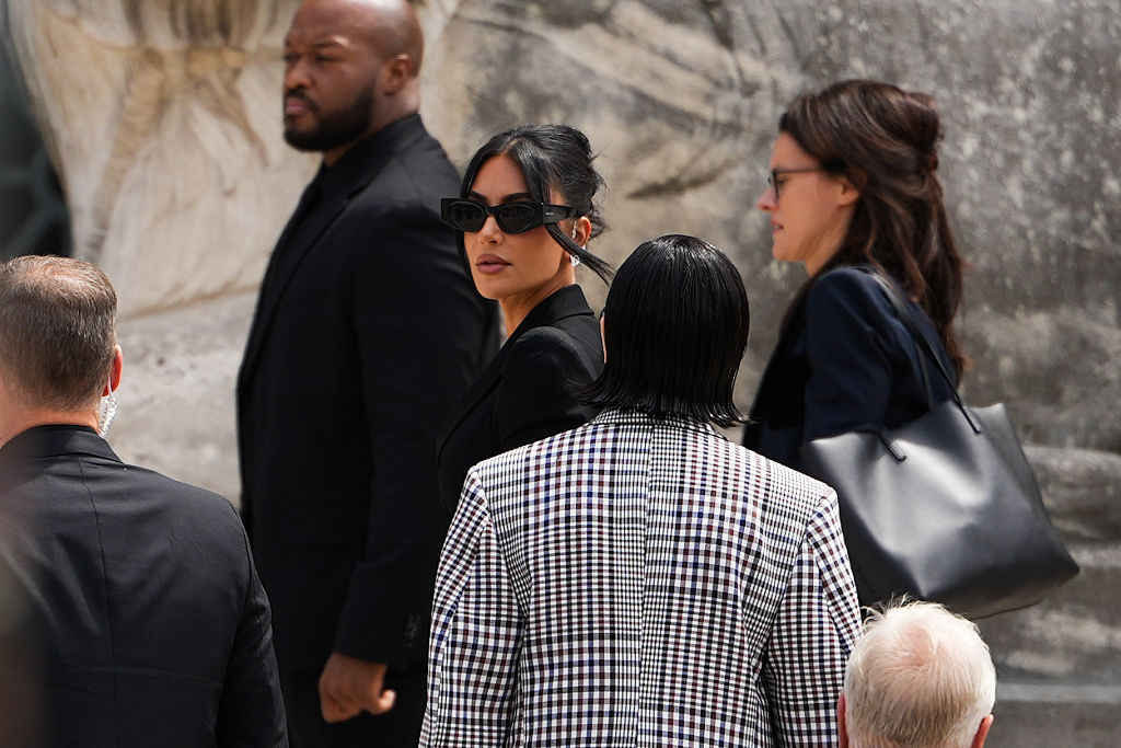 Kim Kardashian arrives at the Palais de Justice, Alaia sunglasses, on May 13, 2025 in Paris, France.