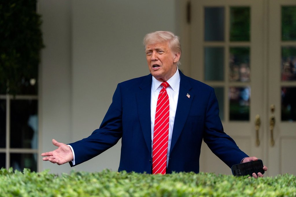 President Donald Trump speaks with reporters in front of the West Wing of the White House, Thursday, May 8, 2025, in Washington. 